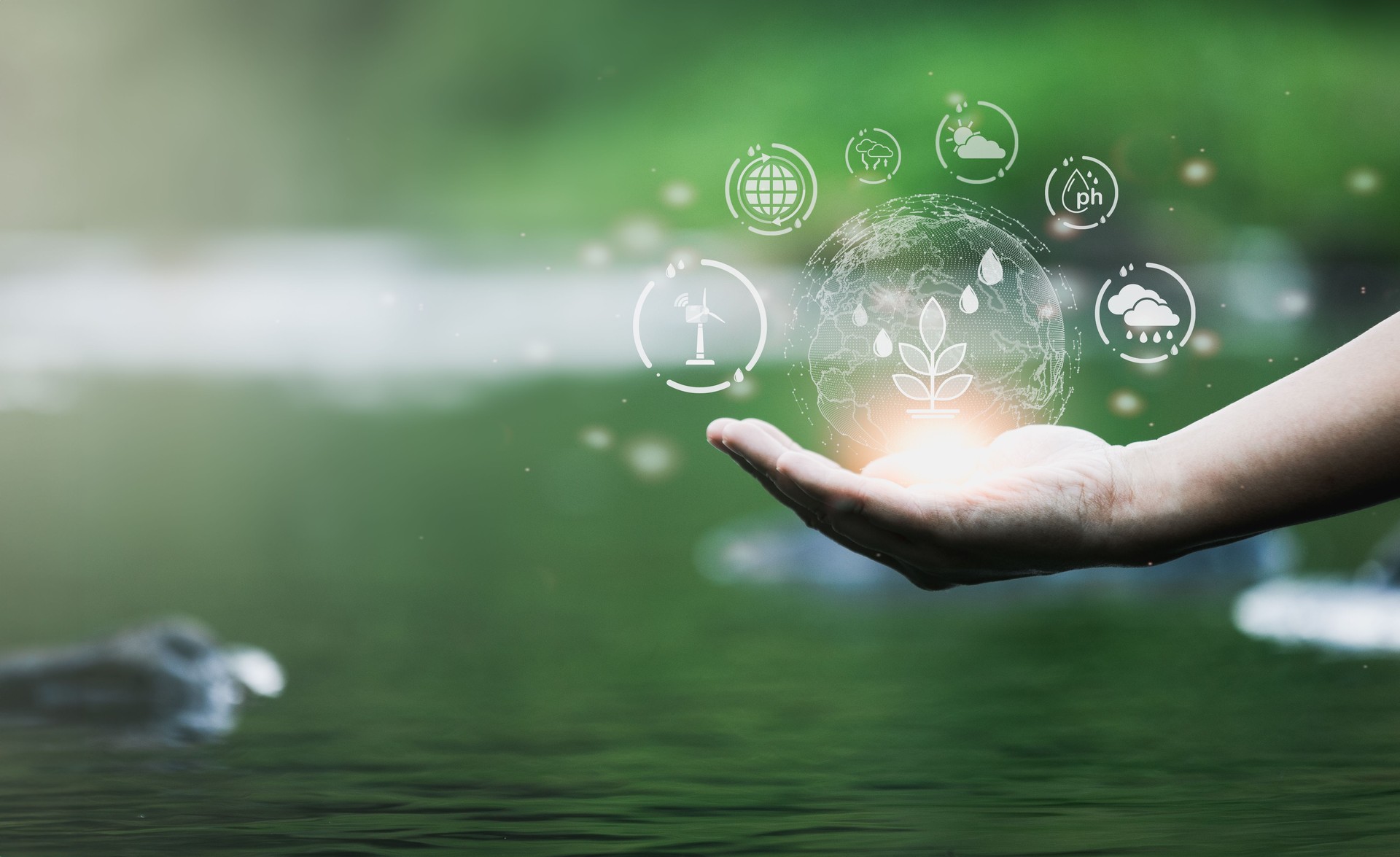 Virtual screen with environmental icons on hand in the water natural background. ESG Environment Social Governance to sustainable development and ecology concept.